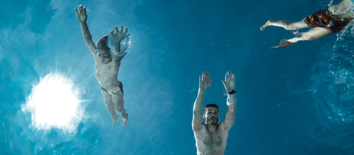 men-diving-into-water