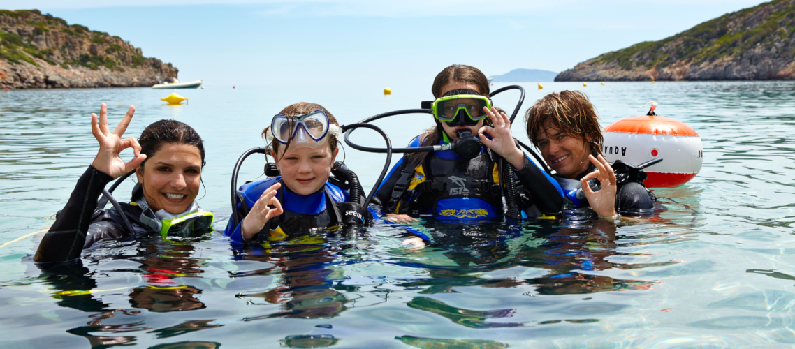 Little Guest Hotels Collection Family diving scuba in water.jpg