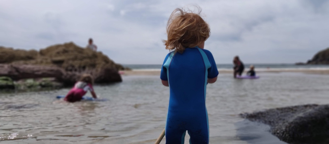 child-water-suit-on-the-beach