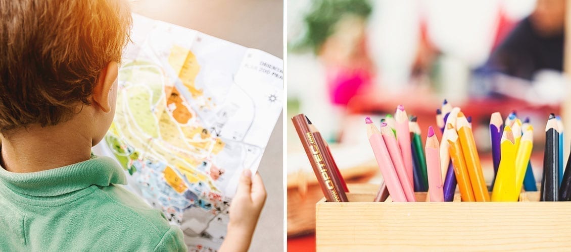 child-looking-at-map-and-colored-pencils