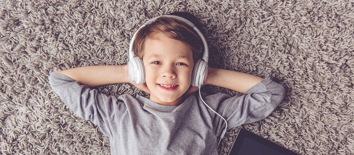 Article Podcasts - little boy listening music