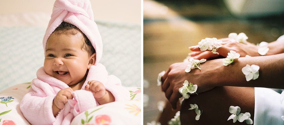 Happy baby with a pink towel