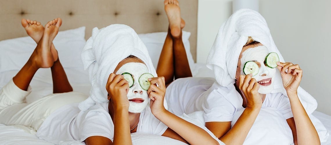 Mom and daughter treating themselves with a spa session