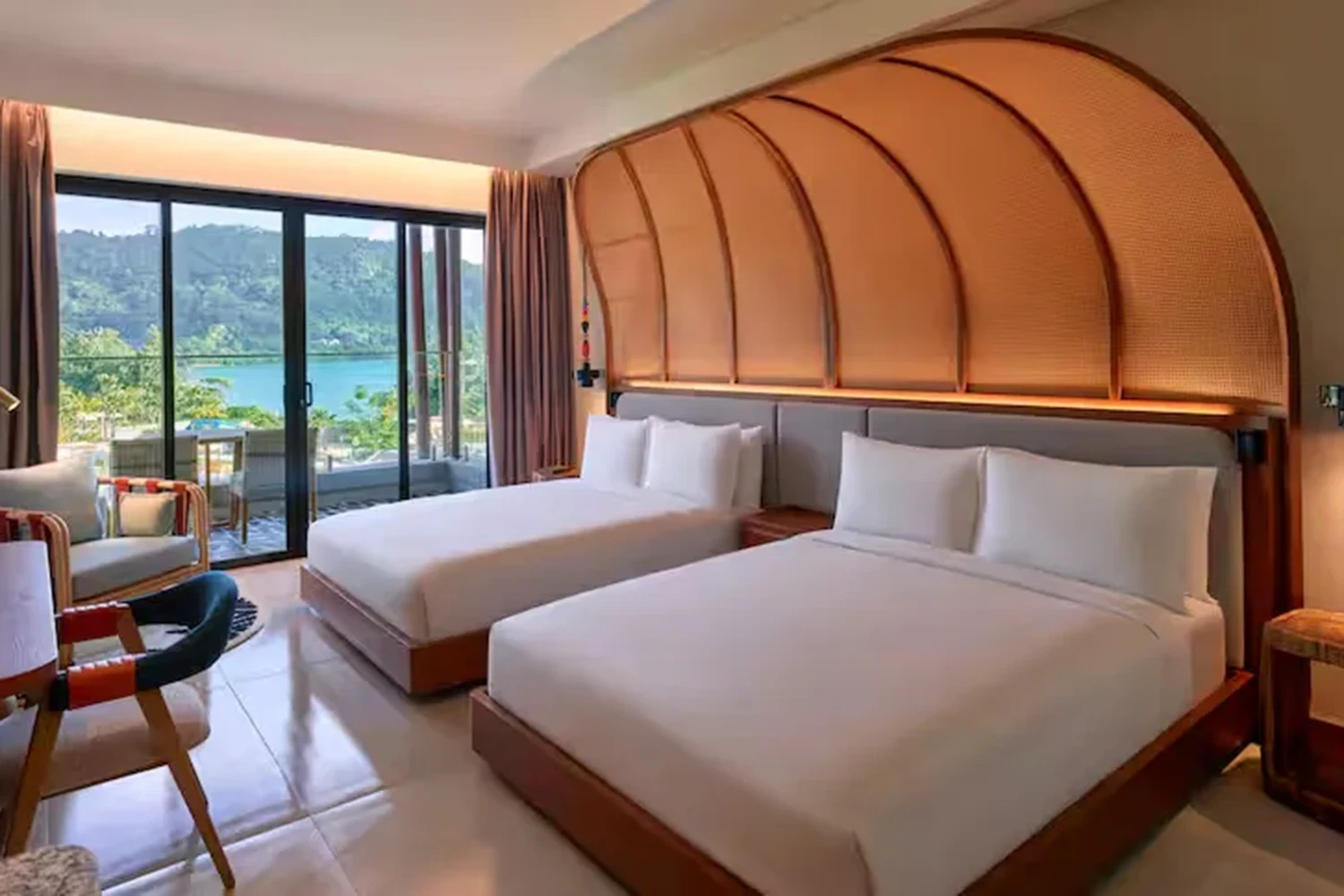 Room with two large beds and pool view